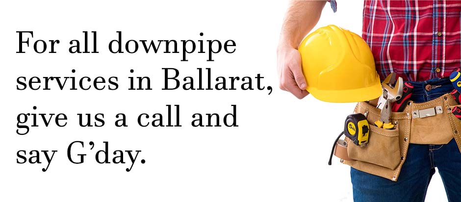 Plumber standing with tools on a white background with text relating to downpipe services
